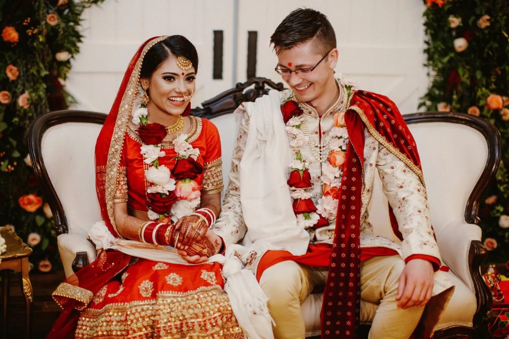 The bride, groom, and guests traditional indian wedding clothes